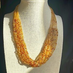 Golden seed bead multi strand necklace! Gorgeous over a T or under a collar!